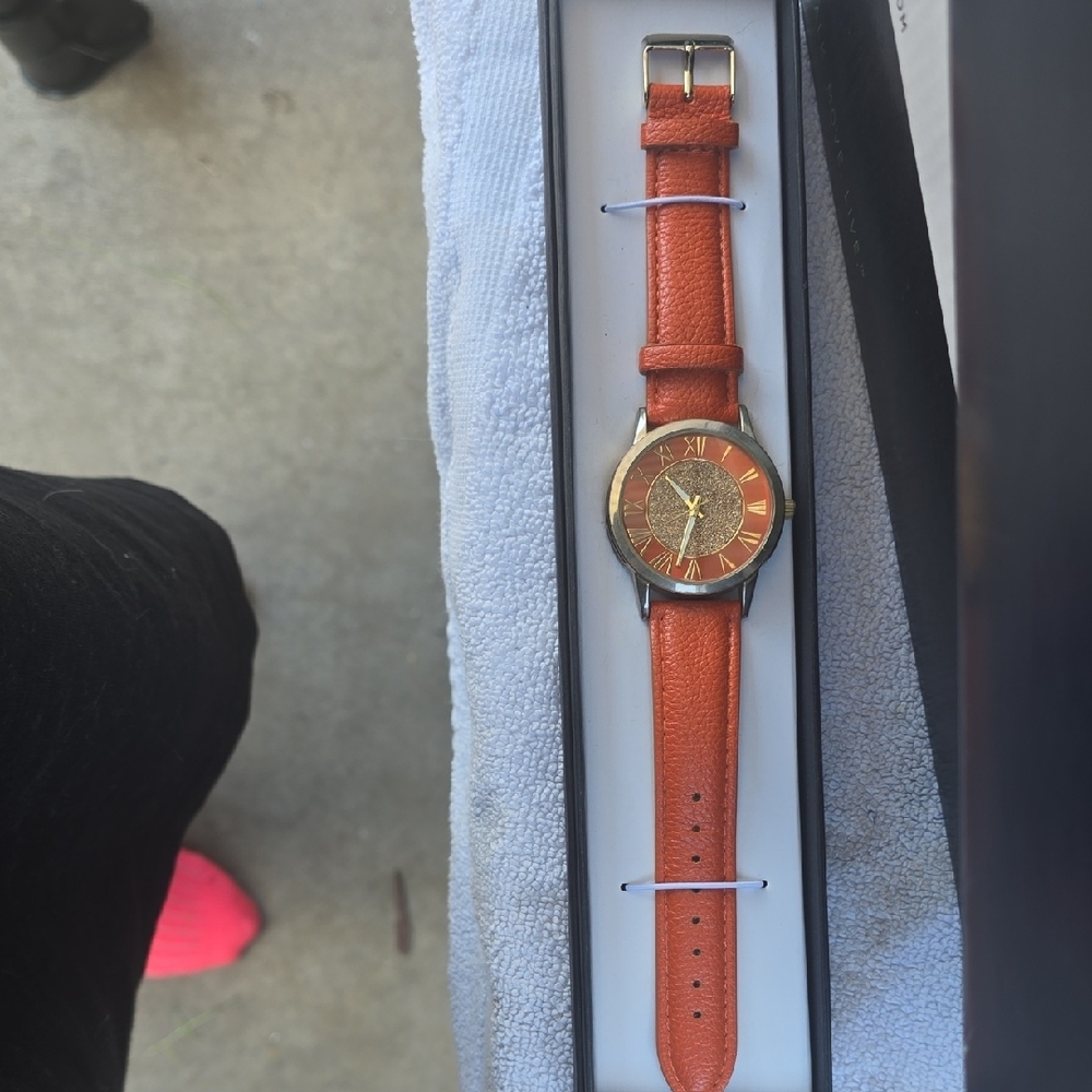 Elegant Orange Strap Watch with Gold Face